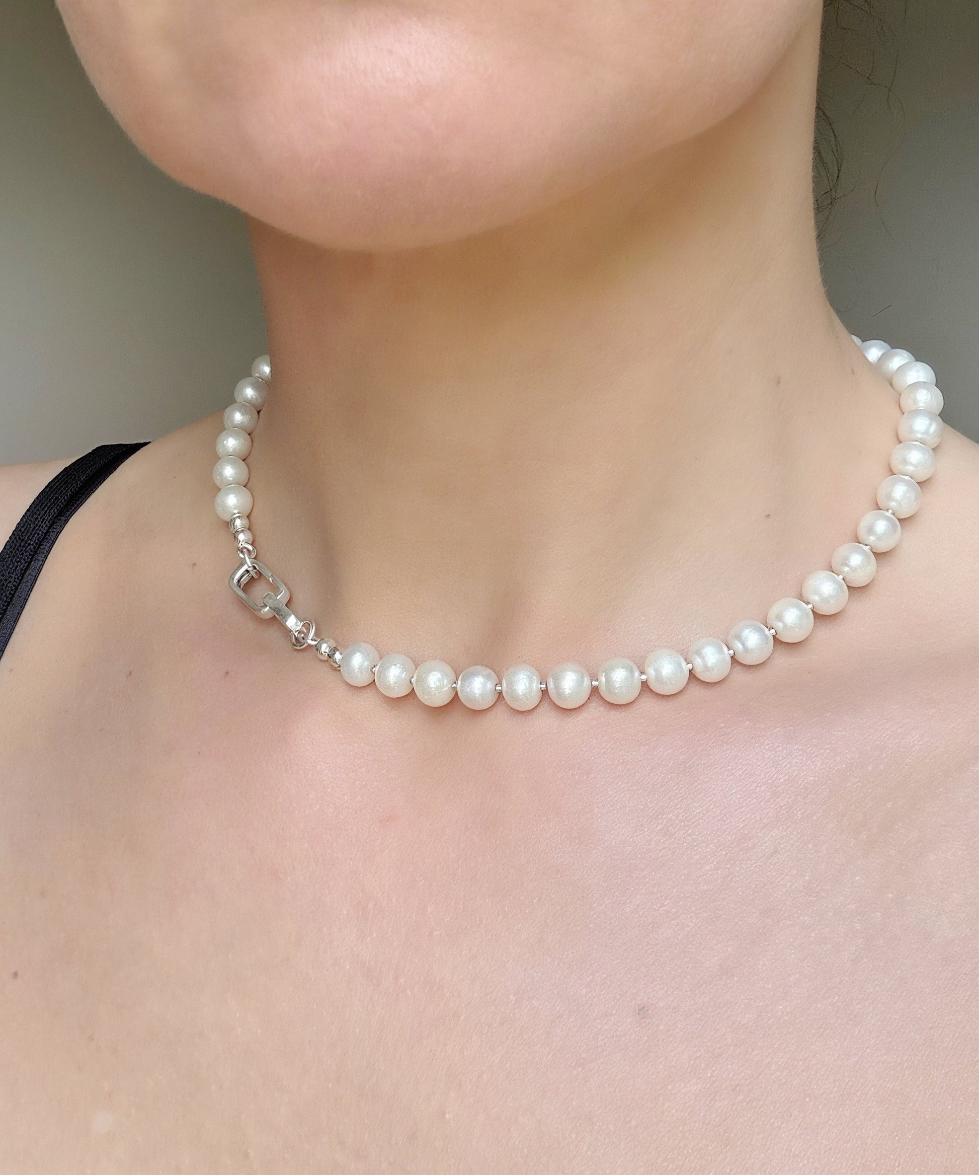 woman wearing pearl necklace
